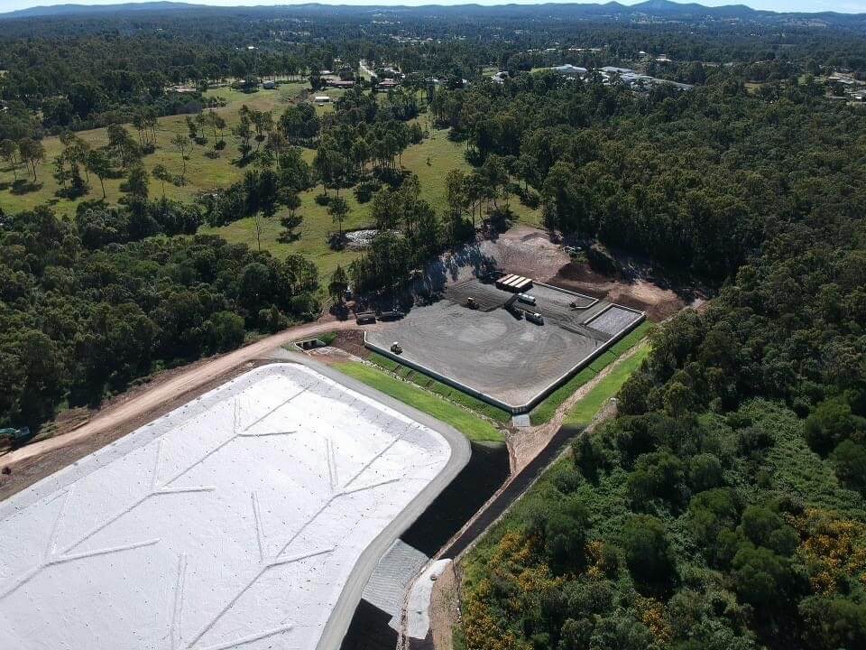 an aerial view of a property surrounded by trees